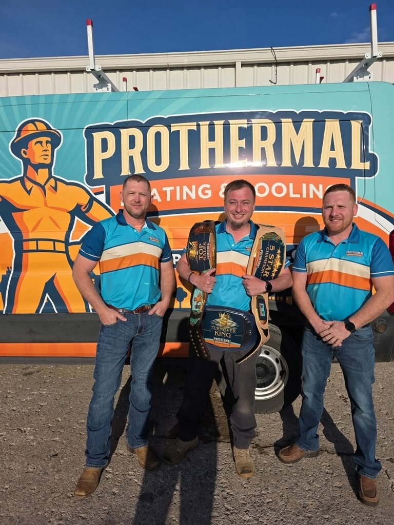 Prothermal Heating and Cooling team with championship belts
